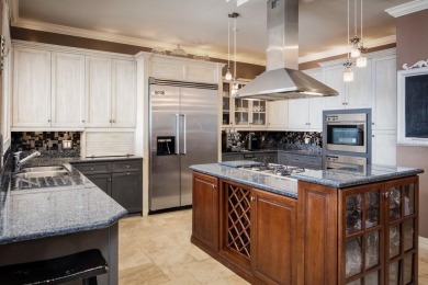 Experience refined lakefront living in this exceptional estate on Isleworth Golf and Country Club in Florida - for sale on GolfHomes.com, golf home, golf lot