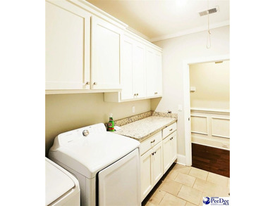 Experience peaceful luxury living at 309 Dormie Lane, located on The Members Club At Woodcreek in South Carolina - for sale on GolfHomes.com, golf home, golf lot