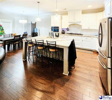 Experience peaceful luxury living at 309 Dormie Lane, located on The Members Club At Woodcreek in South Carolina - for sale on GolfHomes.com, golf home, golf lot