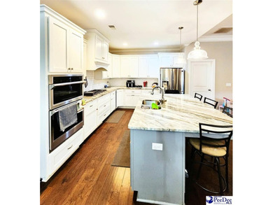 Experience peaceful luxury living at 309 Dormie Lane, located on The Members Club At Woodcreek in South Carolina - for sale on GolfHomes.com, golf home, golf lot