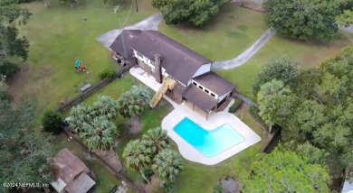 This 3,473 sq ft, two-story brick and stucco home offers four on Starke Golf and Country Club in Florida - for sale on GolfHomes.com, golf home, golf lot