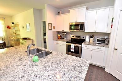 Welcome Home to a charming Villa tucked away in the cul-de-sac on The Golf Club At Rocky Mount in North Carolina - for sale on GolfHomes.com, golf home, golf lot