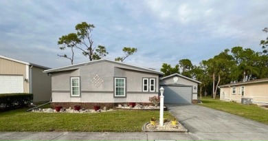 This Casa Grande model home has a view of the golf course from on Del Tura Golf and Country Club in Florida - for sale on GolfHomes.com, golf home, golf lot