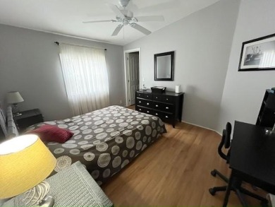 This Casa Grande model home has a view of the golf course from on Del Tura Golf and Country Club in Florida - for sale on GolfHomes.com, golf home, golf lot