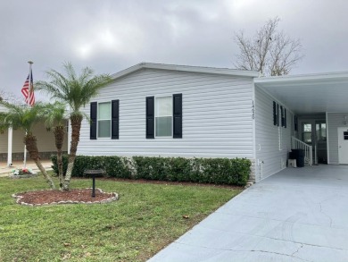 Welcome to this beautifully maintained Palm Harbor home on Fairways Country Club in Florida - for sale on GolfHomes.com, golf home, golf lot