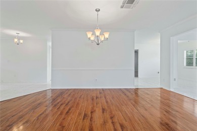 Welcome home to this spacious 2-bedroom, 2-bath residence that on Falcon Watch Golf Club in Florida - for sale on GolfHomes.com, golf home, golf lot