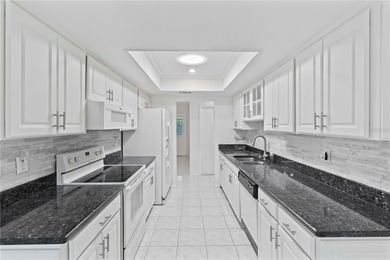 Welcome home to this spacious 2-bedroom, 2-bath residence that on Falcon Watch Golf Club in Florida - for sale on GolfHomes.com, golf home, golf lot