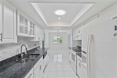 Welcome home to this spacious 2-bedroom, 2-bath residence that on Falcon Watch Golf Club in Florida - for sale on GolfHomes.com, golf home, golf lot