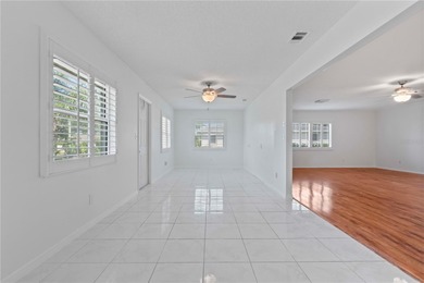 Welcome home to this spacious 2-bedroom, 2-bath residence that on Falcon Watch Golf Club in Florida - for sale on GolfHomes.com, golf home, golf lot