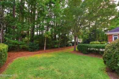 This stately brick home in Brandywine Bay enjoys a prime setting on Brandywine Bay Golf Club in North Carolina - for sale on GolfHomes.com, golf home, golf lot