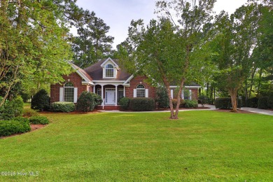 This stately brick home in Brandywine Bay enjoys a prime setting on Brandywine Bay Golf Club in North Carolina - for sale on GolfHomes.com, golf home, golf lot