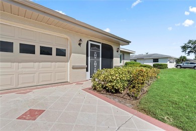 Welcome home to this spacious 2-bedroom, 2-bath residence that on Falcon Watch Golf Club in Florida - for sale on GolfHomes.com, golf home, golf lot