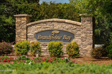 This stately brick home in Brandywine Bay enjoys a prime setting on Brandywine Bay Golf Club in North Carolina - for sale on GolfHomes.com, golf home, golf lot