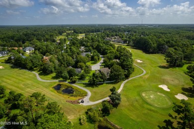 This stately brick home in Brandywine Bay enjoys a prime setting on Brandywine Bay Golf Club in North Carolina - for sale on GolfHomes.com, golf home, golf lot
