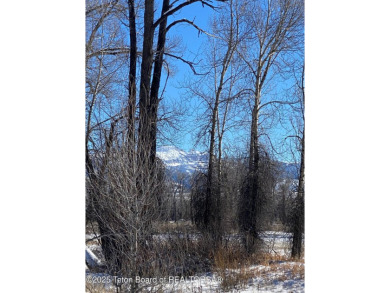 Enjoy beautiful Grand Teton views from this premier .84 acre lot on Jackson Hole Golf and Tennis Club in Wyoming - for sale on GolfHomes.com, golf home, golf lot