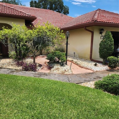 This meticulously maintained one owner home offers over 2,900 on The Grand Club - Pine Lakes Course in Florida - for sale on GolfHomes.com, golf home, golf lot