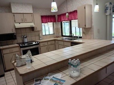 This meticulously maintained one owner home offers over 2,900 on The Grand Club - Pine Lakes Course in Florida - for sale on GolfHomes.com, golf home, golf lot