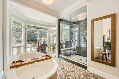 Nestled on a spacious meticulously landscaped site in East Cobbs on Atlanta Country Club in Georgia - for sale on GolfHomes.com, golf home, golf lot