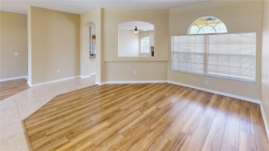 Welcome to this beautifully updated 5-bedroom, 3-bath pool home on The Grand Club - Pine Lakes Course in Florida - for sale on GolfHomes.com, golf home, golf lot
