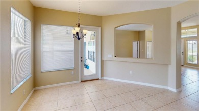 Welcome to this beautifully updated 5-bedroom, 3-bath pool home on The Grand Club - Pine Lakes Course in Florida - for sale on GolfHomes.com, golf home, golf lot