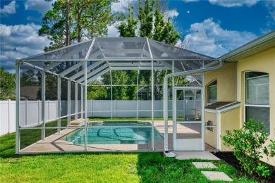 Welcome to this beautifully updated 5-bedroom, 3-bath pool home on The Grand Club - Pine Lakes Course in Florida - for sale on GolfHomes.com, golf home, golf lot