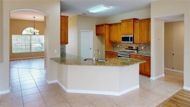 Welcome to this beautifully updated 5-bedroom, 3-bath pool home on The Grand Club - Pine Lakes Course in Florida - for sale on GolfHomes.com, golf home, golf lot