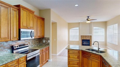 Welcome to this beautifully updated 5-bedroom, 3-bath pool home on The Grand Club - Pine Lakes Course in Florida - for sale on GolfHomes.com, golf home, golf lot