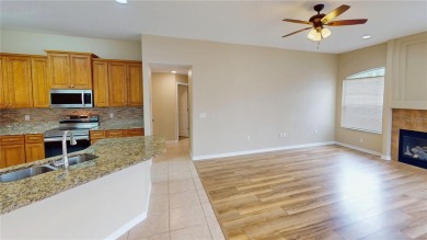 Welcome to this beautifully updated 5-bedroom, 3-bath pool home on The Grand Club - Pine Lakes Course in Florida - for sale on GolfHomes.com, golf home, golf lot