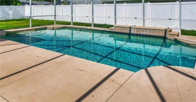 Welcome to this beautifully updated 5-bedroom, 3-bath pool home on The Grand Club - Pine Lakes Course in Florida - for sale on GolfHomes.com, golf home, golf lot