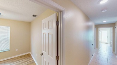 Welcome to this beautifully updated 5-bedroom, 3-bath pool home on The Grand Club - Pine Lakes Course in Florida - for sale on GolfHomes.com, golf home, golf lot