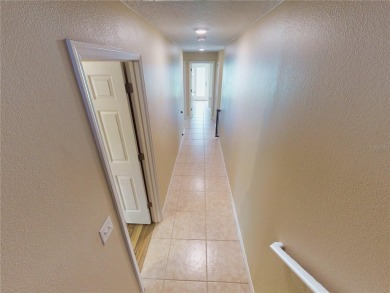 Welcome to this beautifully updated 5-bedroom, 3-bath pool home on The Grand Club - Pine Lakes Course in Florida - for sale on GolfHomes.com, golf home, golf lot