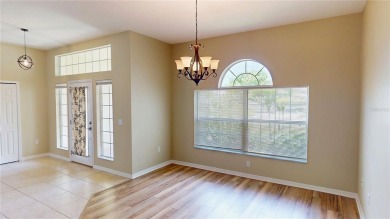 Welcome to this beautifully updated 5-bedroom, 3-bath pool home on The Grand Club - Pine Lakes Course in Florida - for sale on GolfHomes.com, golf home, golf lot