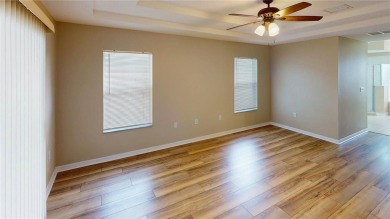Welcome to this beautifully updated 5-bedroom, 3-bath pool home on The Grand Club - Pine Lakes Course in Florida - for sale on GolfHomes.com, golf home, golf lot