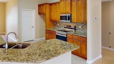 NEW ROOF 2021! Welcome to this beautifully updated 5-bedroom on The Grand Club - Pine Lakes Course in Florida - for sale on GolfHomes.com, golf home, golf lot