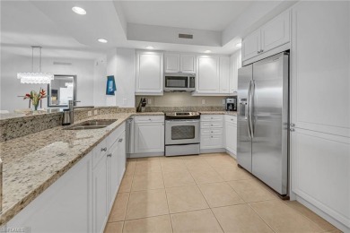 In a lush, tropical oasis, this second-floor resort-style on The Colony Golf and Country Club in Florida - for sale on GolfHomes.com, golf home, golf lot