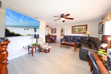 COMPLETELY REMODELED AND UPDATED 3/2/2 SAILBOAT WATER POOL HOME on Saint Andrews South Golf Club in Florida - for sale on GolfHomes.com, golf home, golf lot