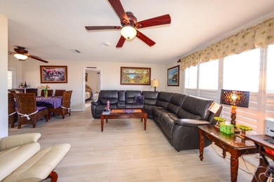 COMPLETELY REMODELED AND UPDATED 3/2/2 SAILBOAT WATER POOL HOME on Saint Andrews South Golf Club in Florida - for sale on GolfHomes.com, golf home, golf lot