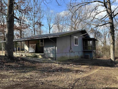 Cute holiday style cabin with end of the road privacy. Level lot on The Course At Turkey Mountain in Arkansas - for sale on GolfHomes.com, golf home, golf lot