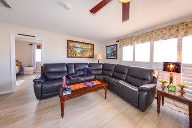 COMPLETELY REMODELED AND UPDATED 3/2/2 SAILBOAT WATER POOL HOME on Saint Andrews South Golf Club in Florida - for sale on GolfHomes.com, golf home, golf lot