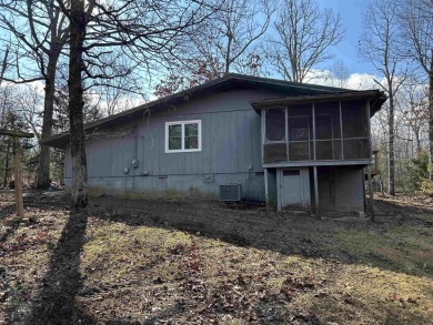 Cute holiday style cabin with end of the road privacy. Level lot on The Course At Turkey Mountain in Arkansas - for sale on GolfHomes.com, golf home, golf lot