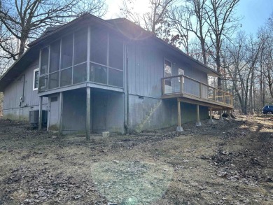 Cute holiday style cabin with end of the road privacy. Level lot on The Course At Turkey Mountain in Arkansas - for sale on GolfHomes.com, golf home, golf lot