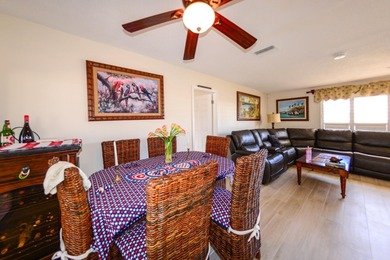 COMPLETELY REMODELED AND UPDATED 3/2/2 SAILBOAT WATER POOL HOME on Saint Andrews South Golf Club in Florida - for sale on GolfHomes.com, golf home, golf lot