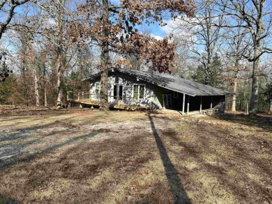 Cute holiday style cabin with end of the road privacy. Level lot on The Course At Turkey Mountain in Arkansas - for sale on GolfHomes.com, golf home, golf lot