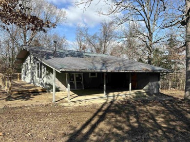 Cute holiday style cabin with end of the road privacy. Level lot on The Course At Turkey Mountain in Arkansas - for sale on GolfHomes.com, golf home, golf lot