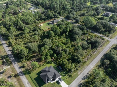 This 1/2 acre lot is located in a fast-growing side of Lehigh on Lehigh Resort Club in Florida - for sale on GolfHomes.com, golf home, golf lot