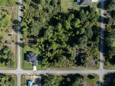 This 1/2 acre lot is located in a fast-growing side of Lehigh on Lehigh Resort Club in Florida - for sale on GolfHomes.com, golf home, golf lot