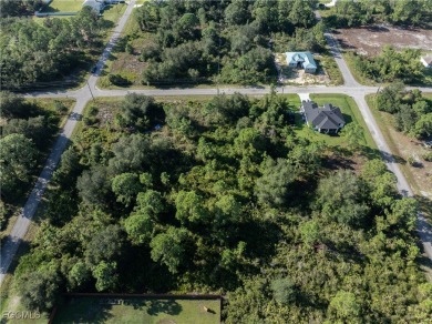 This 1/2 acre lot is located in a fast-growing side of Lehigh on Lehigh Resort Club in Florida - for sale on GolfHomes.com, golf home, golf lot