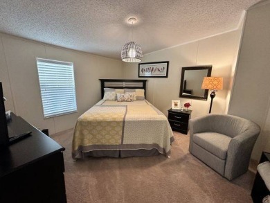 Nestled on a serene cul-de-sac overlooking the 6th Tee and lush on Four Lakes Golf Club in Florida - for sale on GolfHomes.com, golf home, golf lot