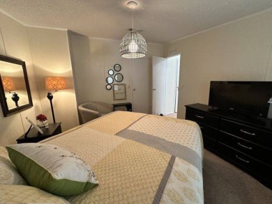 Nestled on a serene cul-de-sac overlooking the 6th Tee and lush on Four Lakes Golf Club in Florida - for sale on GolfHomes.com, golf home, golf lot
