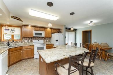 Ideally situated on a corner lot, this well-kept rambler offers on Dodge Country Club in Minnesota - for sale on GolfHomes.com, golf home, golf lot